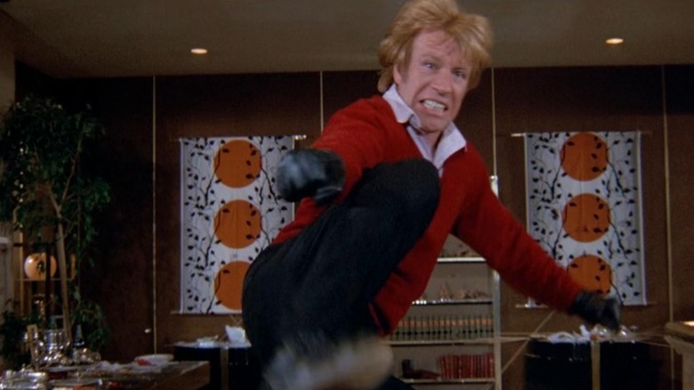 Chuck Norris as Kane kicking someone in An Eye for an Eye