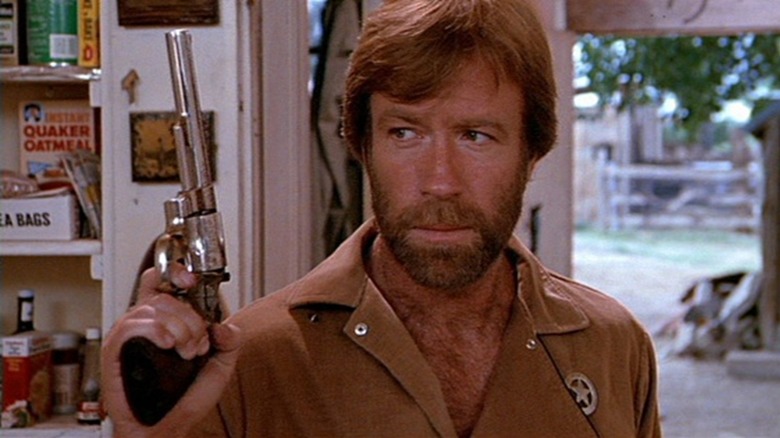 McQuade (Chuck Norris) holds a gun in Lone Wolf McQuade