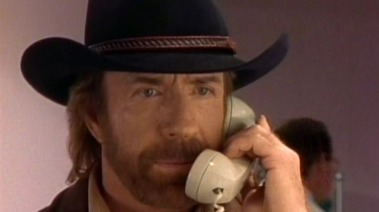 Chuck Norris as Walker talks on the phone on Walker Texas Ranger