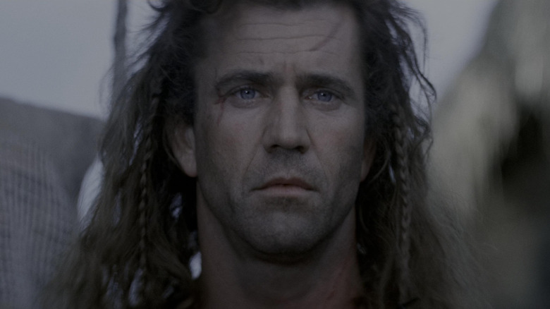 Mel Gibson as William Wallace in Braveheart, looking forlornly off into the distance.