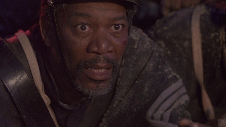 Morgan Freeman as Sergeant Major John Rawlins in Glory, in a dirtied uniform and looking worried off into the distance.