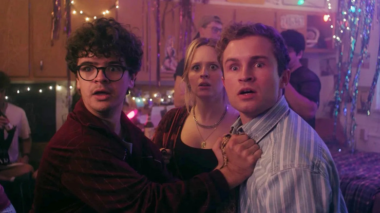Gaten Matarazzo as Jack, Lulu Wilson as Lizzy, and Sean Giambrone as Montgomery staring in shock in Pizza Movie