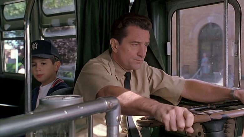 Lorenzo (Robert De Niro) drives a bus with Calogero (Francis Capra) seated behind him in A Bronx Tale