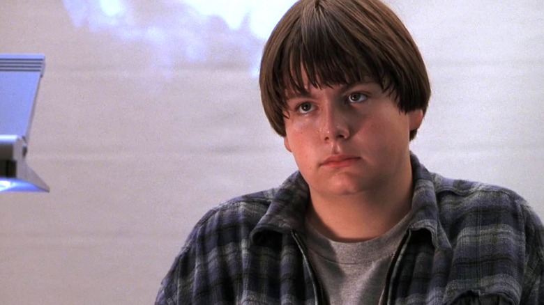 Angus Bethune (Charlie Talbert) sits unimpressed in a classroom in Angus