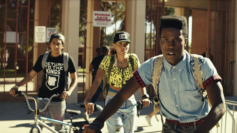 Malcolm Adekanbi (Shameik Moore) is in the foreground while Diggy and Jib stand behind him on their bikes in Dope (2015)