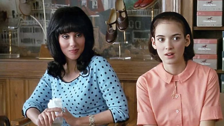 Rachel Flax (Cher) and Charlotte Flax (Winona Ryder) sit together in a shoe store in Mermaids (1990)
