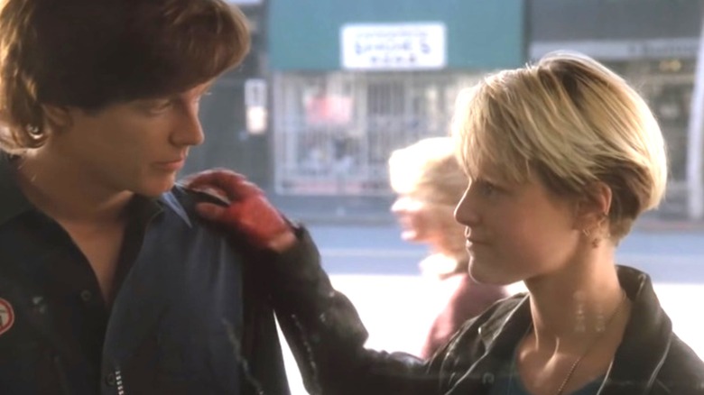 Watts (Mary Stuart Masterson) touches the shoulder of Keith Nelson (Eric Stoltz) in Some Kind of Wonderful