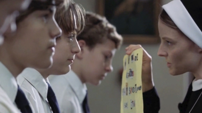 Francis Doyle (Emile Hirsch) and Tim Sullivan (Kieran Culkin) stand in a line opposite Jodie Foster's nun character in The Dangerous Lives of Altar Boys