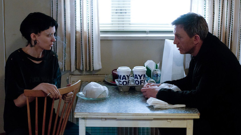 Daniel Craig in the Girl with the Dragon Tattoo drinking coffee with Rooney Mara