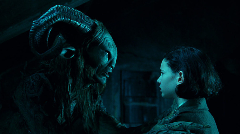 The Faun holding a concerned Ofelia in Pan's Labyrinth