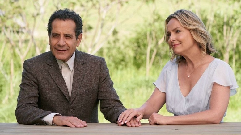 Adrian Monk (Tony Shalhoub) holds hands with Trudy Monk (Melora Hardin) at an outdoor table in Mr. Monk's Last Case