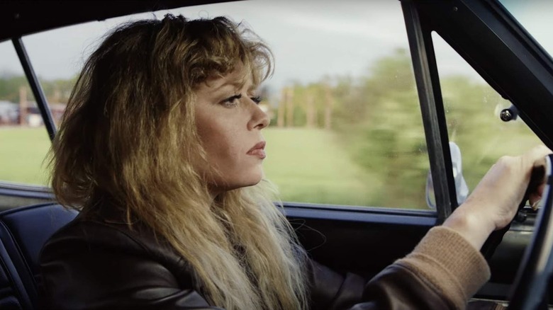 Charlie Cale (Natasha Lyonne) stoically drives her car in Poker Face
