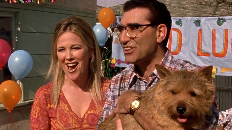 Eugene Levy and Catherine O'Hara holding their dog in Best in Show