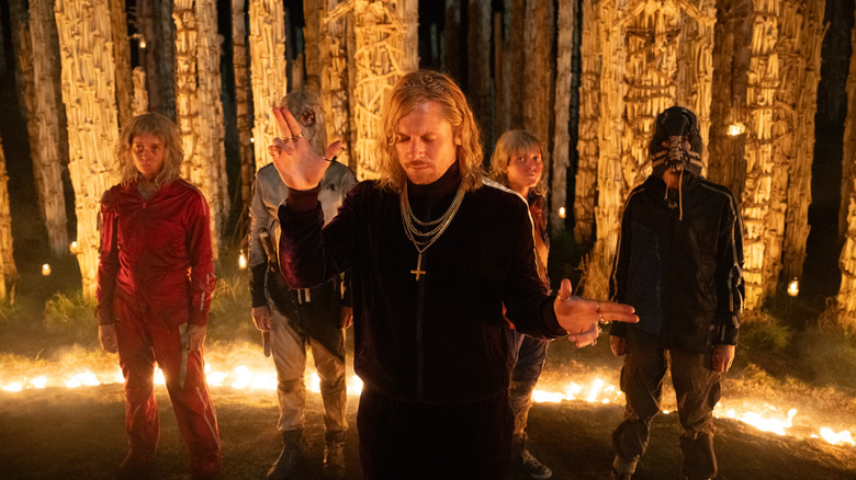 Jack O'Connell as Sir Lord Jimmy Crystal standing before his followers in 28 Years Later: The Bone Temple