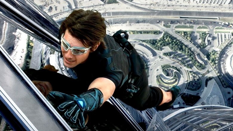 Tom Cruise as Ethan Hunt, climbing the Burj Khalifa in Mission: Impossible - Ghost Protocol.