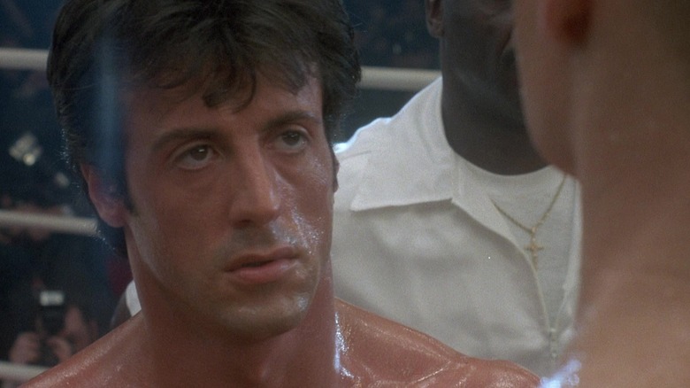 Sylvester Stallone as Rocky Balboa sizing up Dolph Lundgren as Ivan Drago in Rocky IV