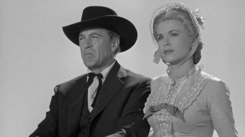 Marshal Will Kane (Gary Cooper) and wife Amy (Grace Kelly) in carriage in High Noon