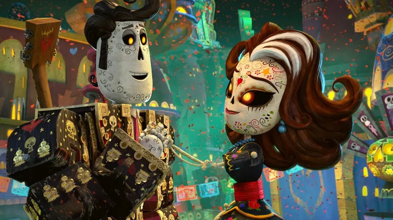 Brightly colored animated frame of man and woman with skeleton heads and bodies in The Book of Life