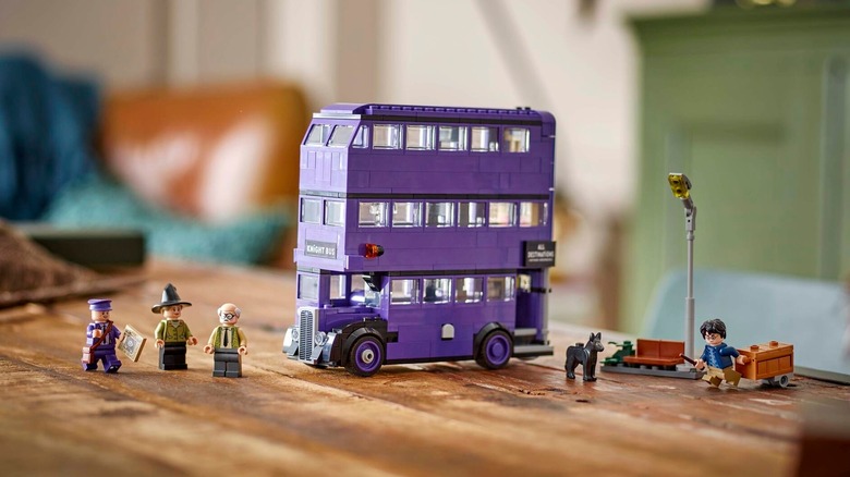 LEGO Knightbus Adventure set displayed on a wood table