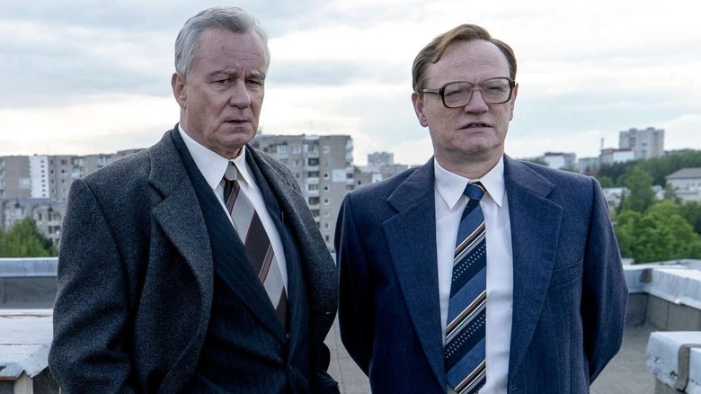 Stellan Skarsgård as Boris Shcherbina and Jared Harris as Valery Legasov, standing on a rooftop in Chernobyl.
