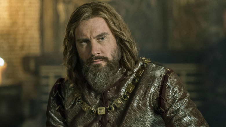 Clive Standen as Rollo, looking to the side in Vikings.