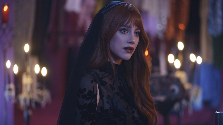 Apple in her coven attire in Forbidden Fruits