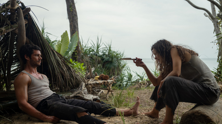 Linda (Rachel McAdams) points a knife at Bradley (Dylan O'Brien) in Send Help