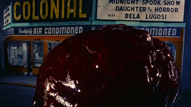 The Blob from The Blob rolling out of a movie theater
