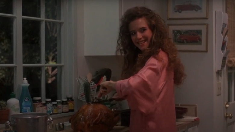 Kelly Preston as Miranda cooking in the kitchen in Spellbinder