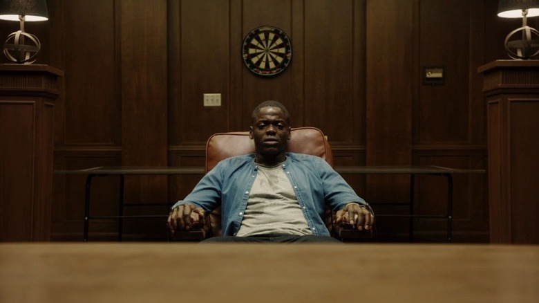 Daniel Kaluuya as Chris Washington, tied to a chair in a den in Get Out