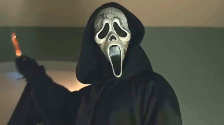 Ghostface holding bloody hunter knife