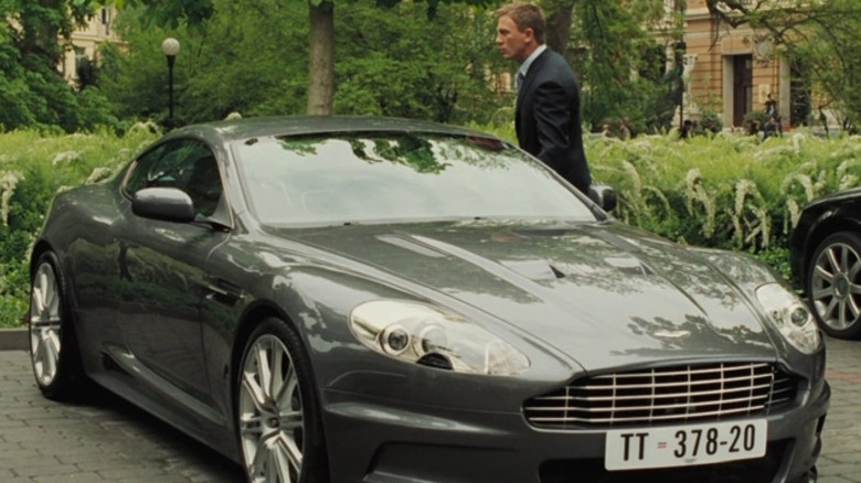 James Bond (Daniel Craig) approaches an Aston Martin DBS V12 in Casino Royale