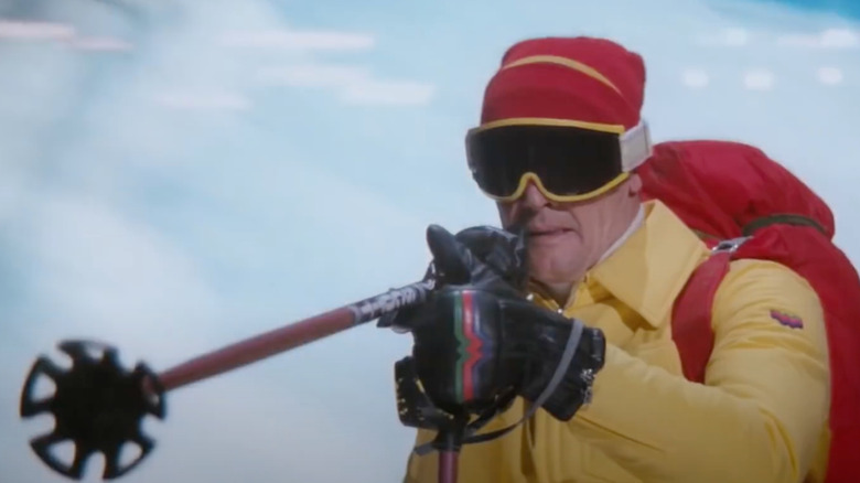 Roger Moore as James Bond points his ski pole gun at a bad guy in The Spy Who Loved Me