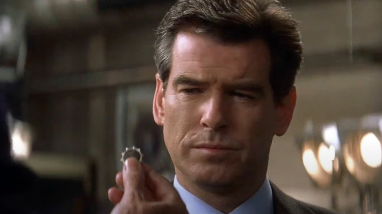 Pierce Brosnan as James Bond looks at a ring in Die Another Day