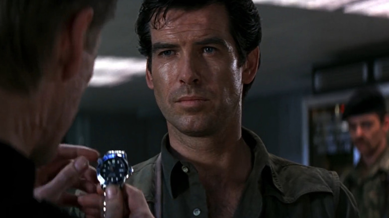 Sean Bean as Alec Trevelyan holds the watch of Pierce Brosnan as James Bond in GoldenEye