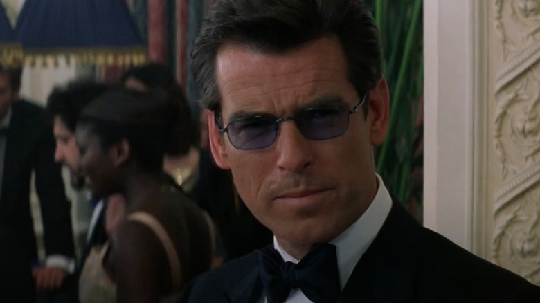 Pierce Brosnan as James Bond wears sunglasses in a casino in The World is Not Enough
