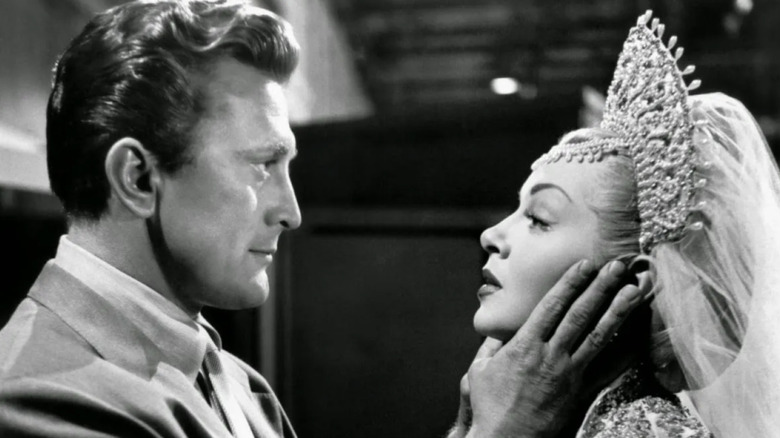 Jonathan Shields (Kirk Douglas) locks eyes with Georgia Lorrison (Lana Turner) in The Bad and The Beautiful