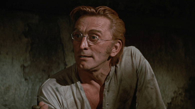 Paris Pitman (Kirk Douglas) in a cave in There Was A Crooked Man