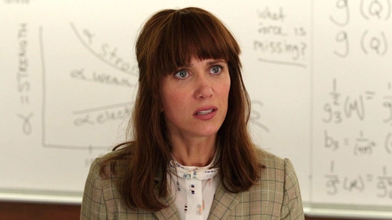 Kristen Wiig standing in front of whiteboard in Ghostbusters