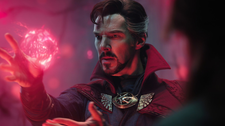 Benedict Cumberbatch as Doctor Strange manipulating glowing red energy in Multiverse of Madness