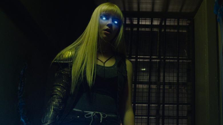 Anya Taylor-Joy as Illyana Rasputina with glowing blue eyes and a metallic arm in The New Mutants