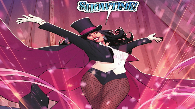 Zatanna in magician's garb saying "Showtime!" with her arms outstretched in a DC comics panel