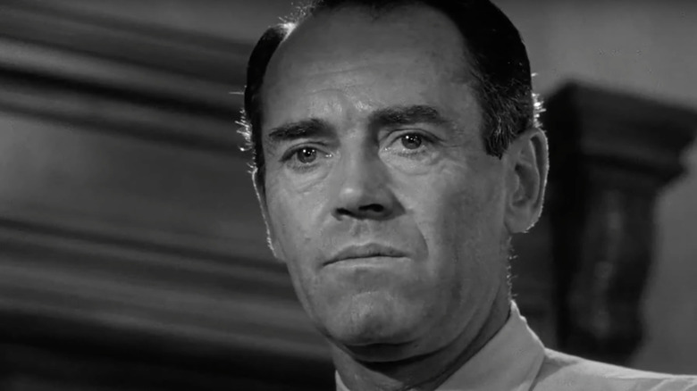Juror #8 (Henry Fonda) looks down contemplatively in 12 Angry Men