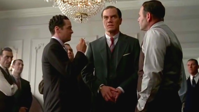 Gangsters crowd around Van Alden