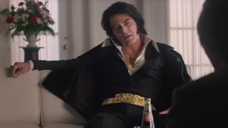 Elvis slouching on a couch