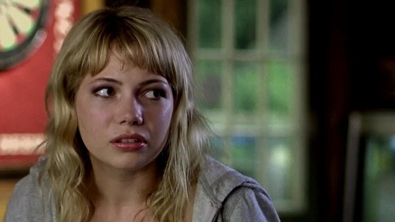 Michelle Williams with bangs looking to the side in The Station Agent