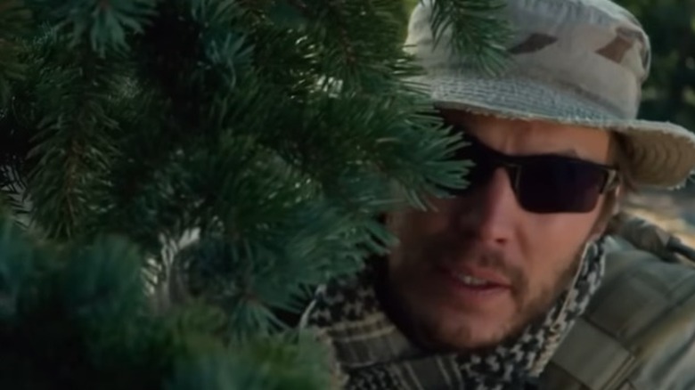 Soldier hiding behind a bush in Lone Survivor