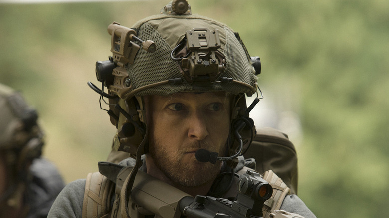 Wozniak (Eric Ladin) pursues in Six.