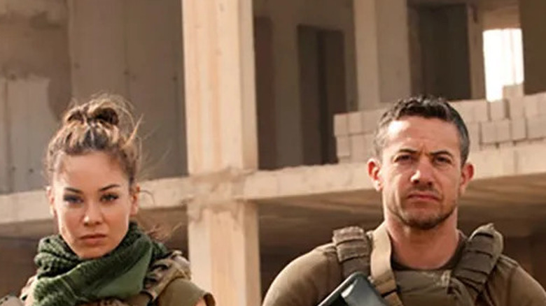 Soldiers approach in Strike Back.