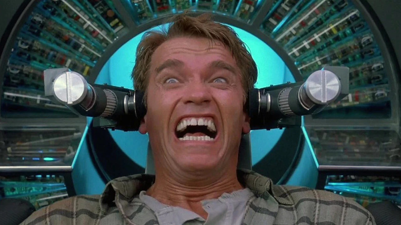 Quaid (Arnold Schwarzenegger) screams in a mind-altering chair in Total Recall